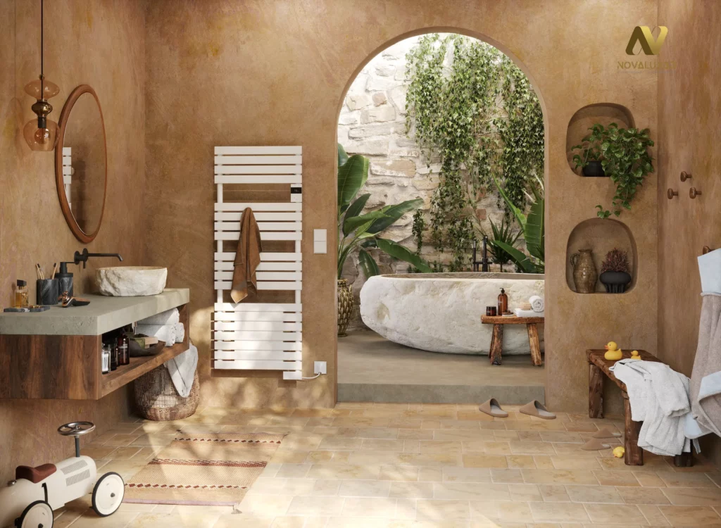 Rendu 3D photoréaliste d’une salle de bain aux tons terre (murs enduit type tadelakt, sol en pierre), avec meuble vasque, radiateur sèche-serviettes blanc et grande arche ouvrant sur une baignoire minérale entourée de végétation.